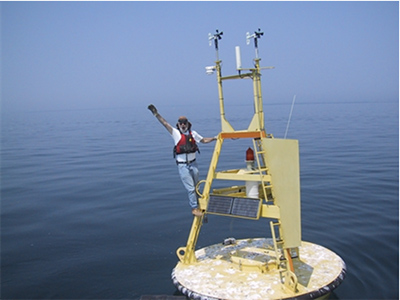 NOAA man on buoy